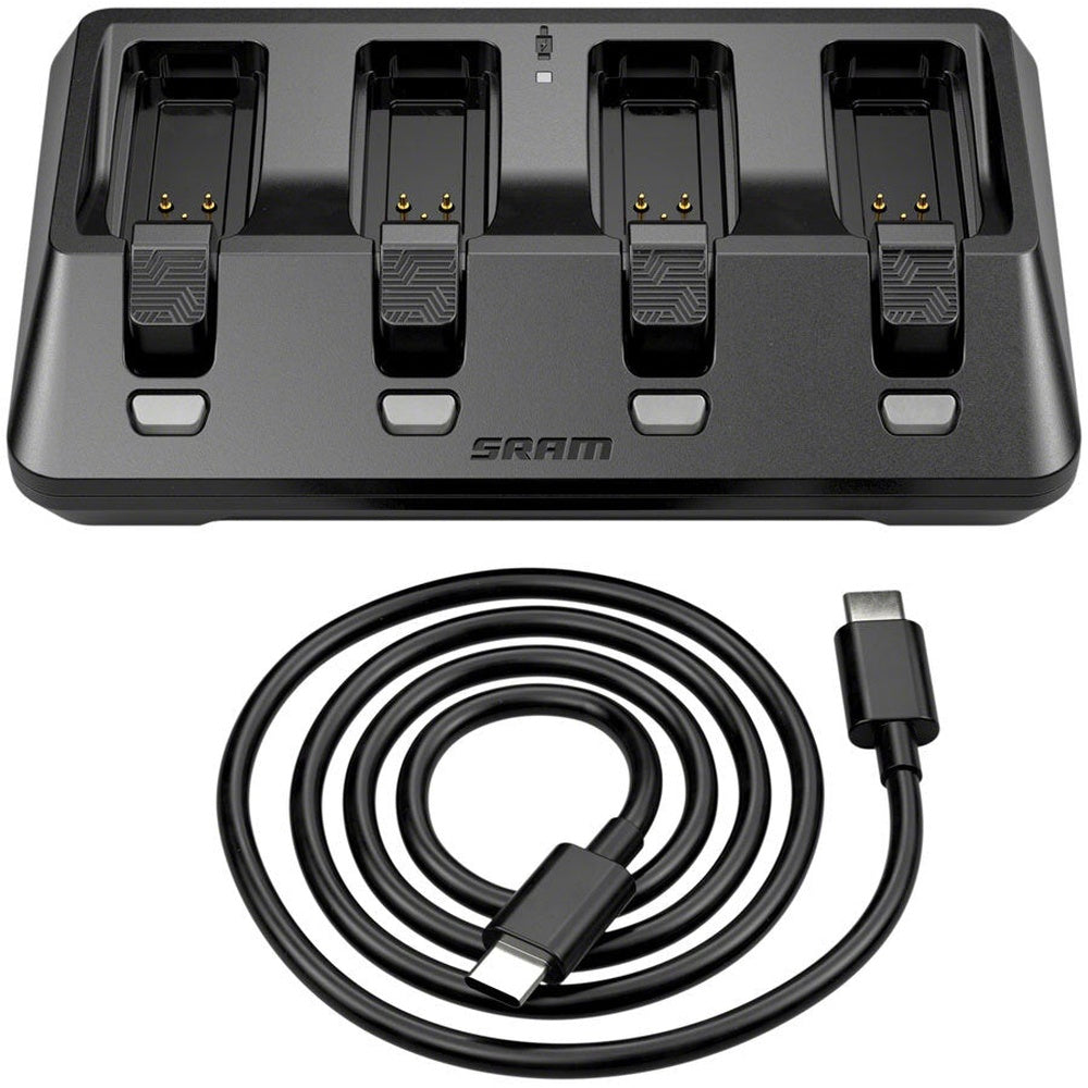 SRAM AXS battery charger with four charging bays and USB-C cable on white background