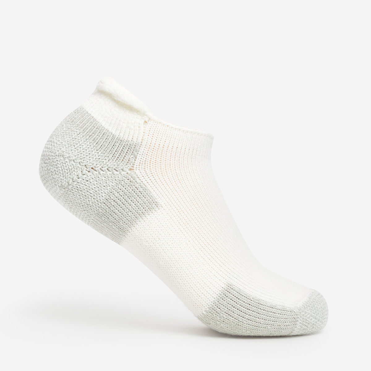 Thorlo white low-cut running sock with gray cushioned heel, toe, and cuff
