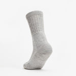 Thorlos light grey crew sock with ribbed cuff and cushioned heel and toe