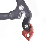 Wheels Manufacturing black and red derailleur hanger with mounting hardware on white background