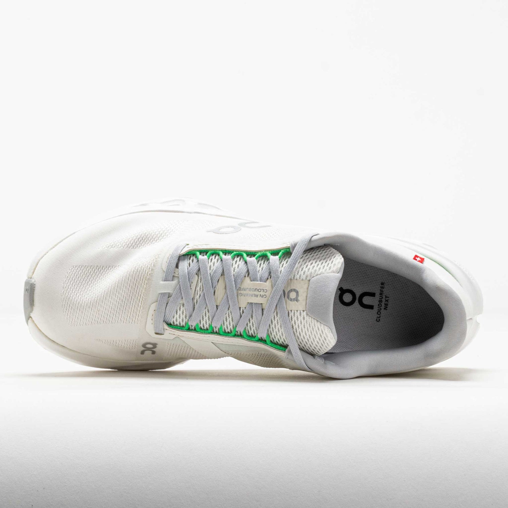 On Cloudsurfer Next women's running shoe in white with gray laces and green accents