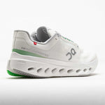 On Cloudsurfer Next women's running shoe in white with green stripe and CloudTec sole
