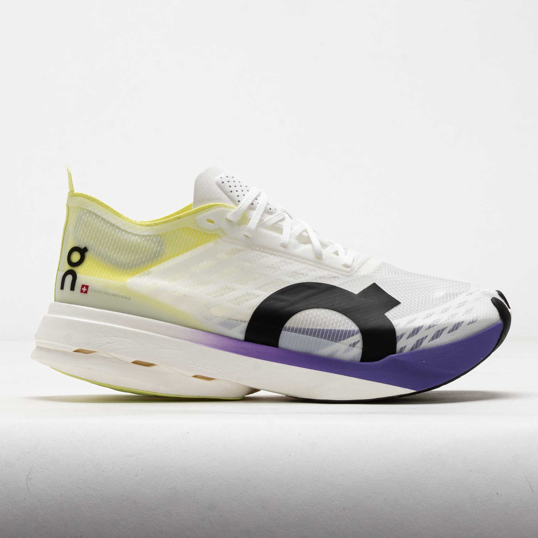 On Cloudboom Strike running shoe in white with lime green and purple accents
