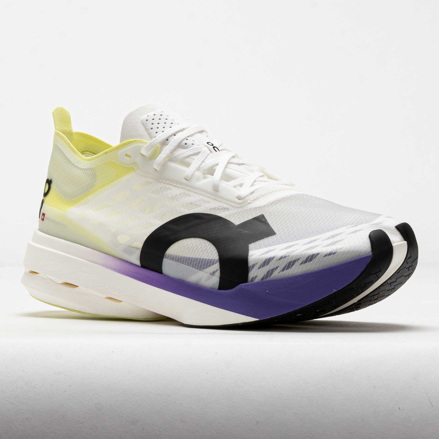 On Cloudboom Strike women's running shoe in white with lime and purple details