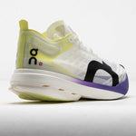 On Cloudboom Strike running shoe in white with lime green and purple details