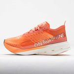 On Cloudboom Strike running shoe in orange sunstone colorway with white sole