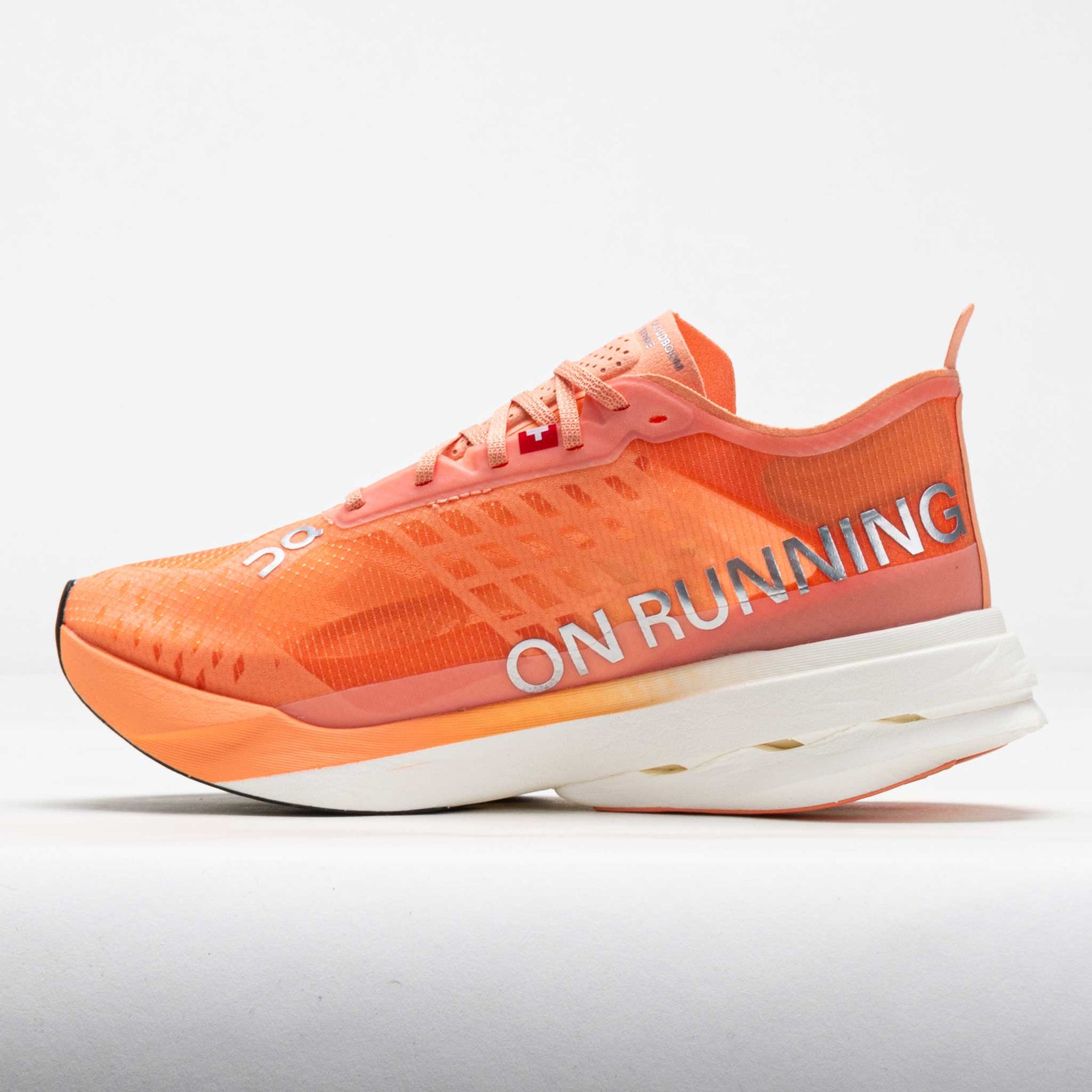 On Cloudboom Strike running shoe in orange sunstone colorway with white sole