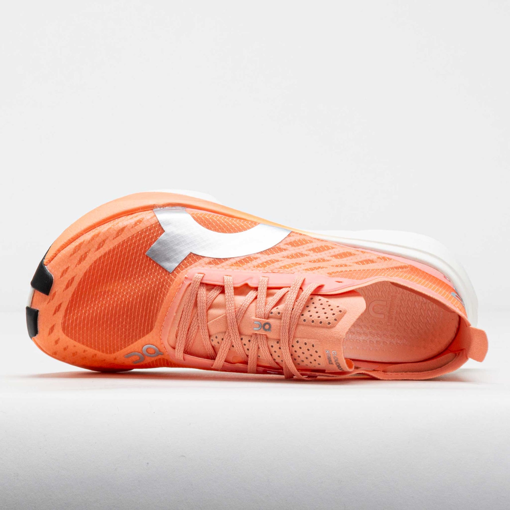 On Cloudboom Strike running shoe in orange sunstone colorway with white details