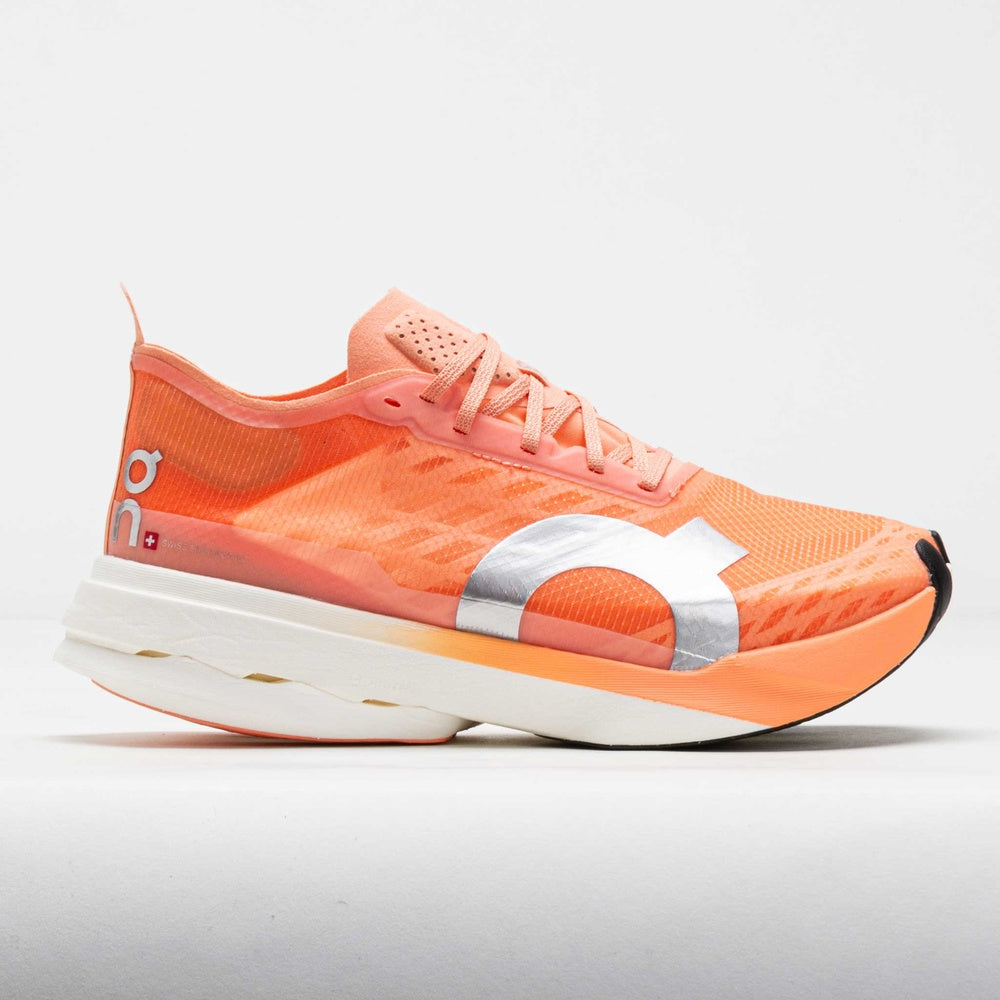 On Cloudboom Strike running shoe in orange sunstone colorway with white sole