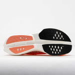 On Cloudboom Strike running shoe sole view showing orange and white colorway
