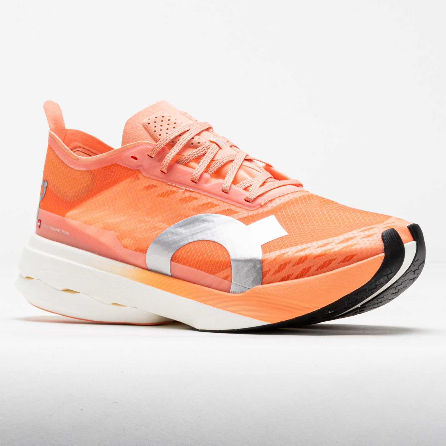 On Cloudboom Strike running shoe in orange sunstone colorway with white sole
