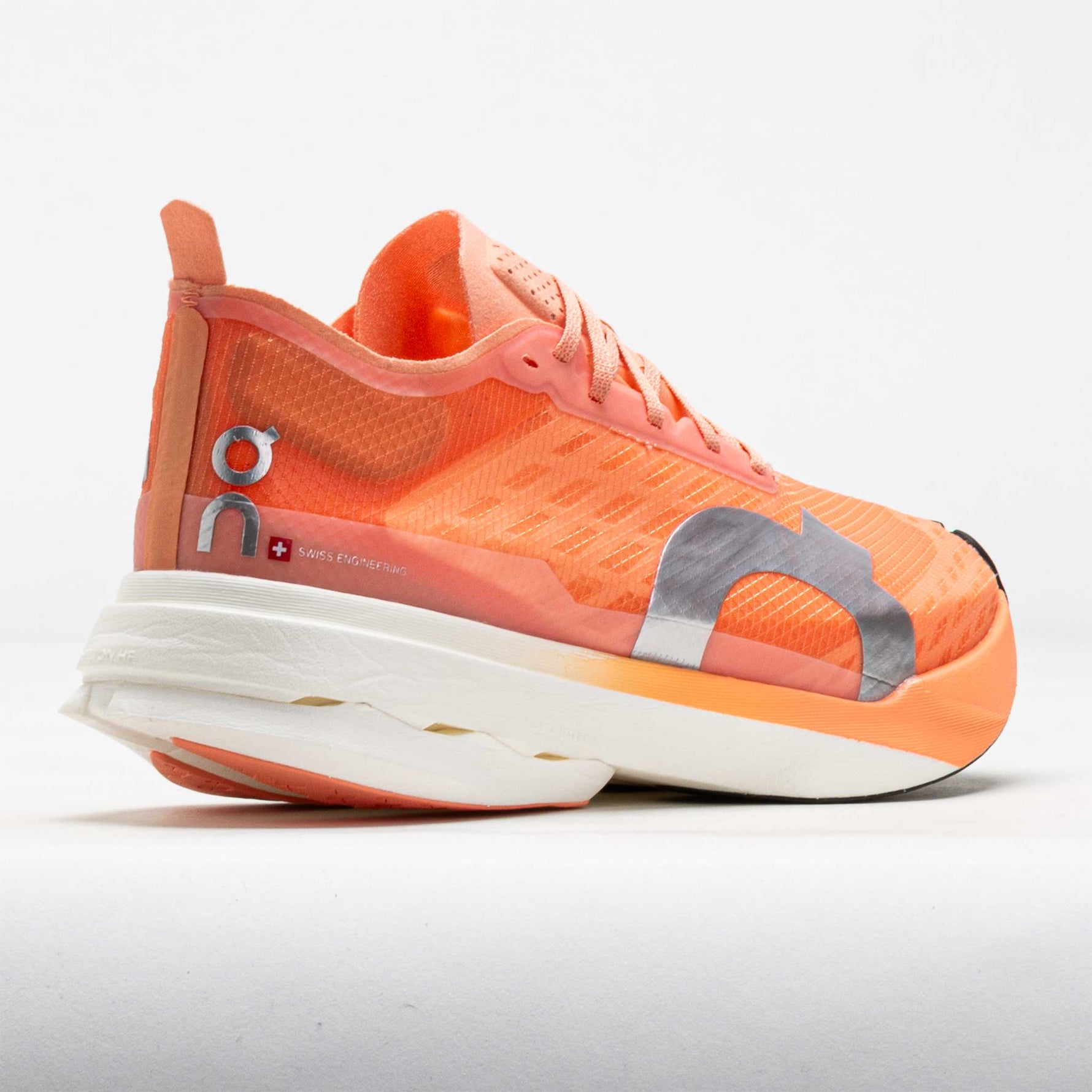 On Cloudboom Strike running shoe in orange sunstone colorway with white sole