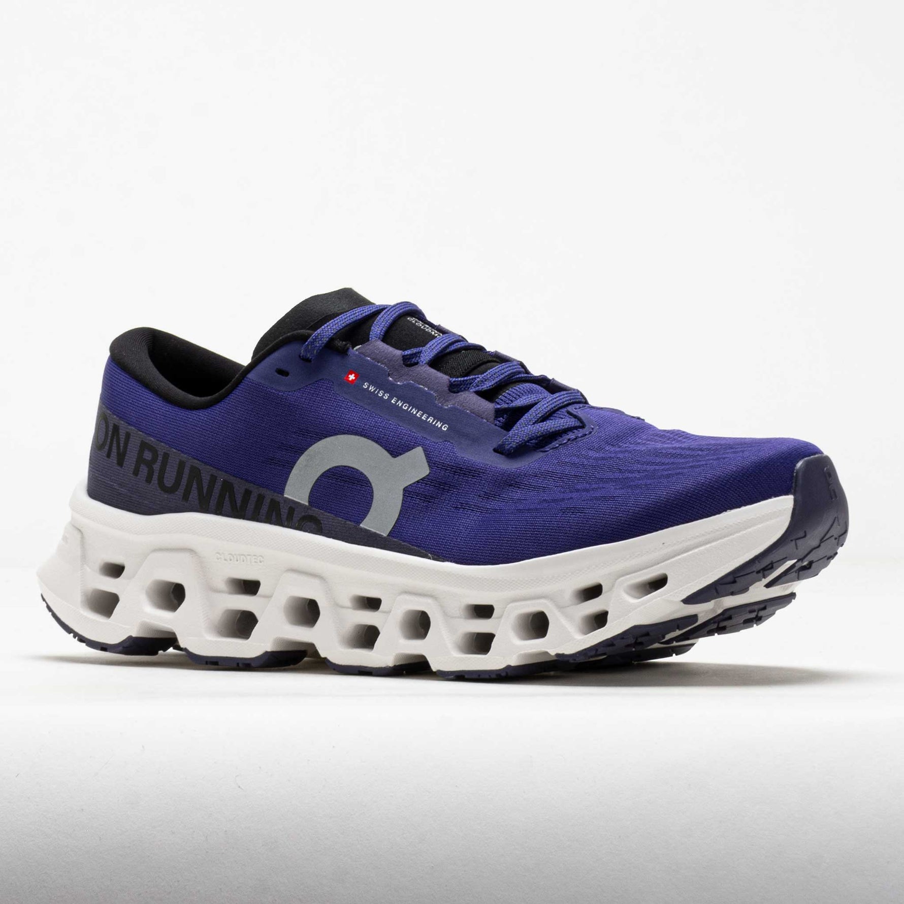 On Cloudmonster 3 running shoes in purple-blue colorway with distinctive white CloudTec sole