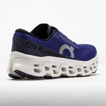 On Cloudmonster running shoe in blue and white with distinctive CloudTec sole technology