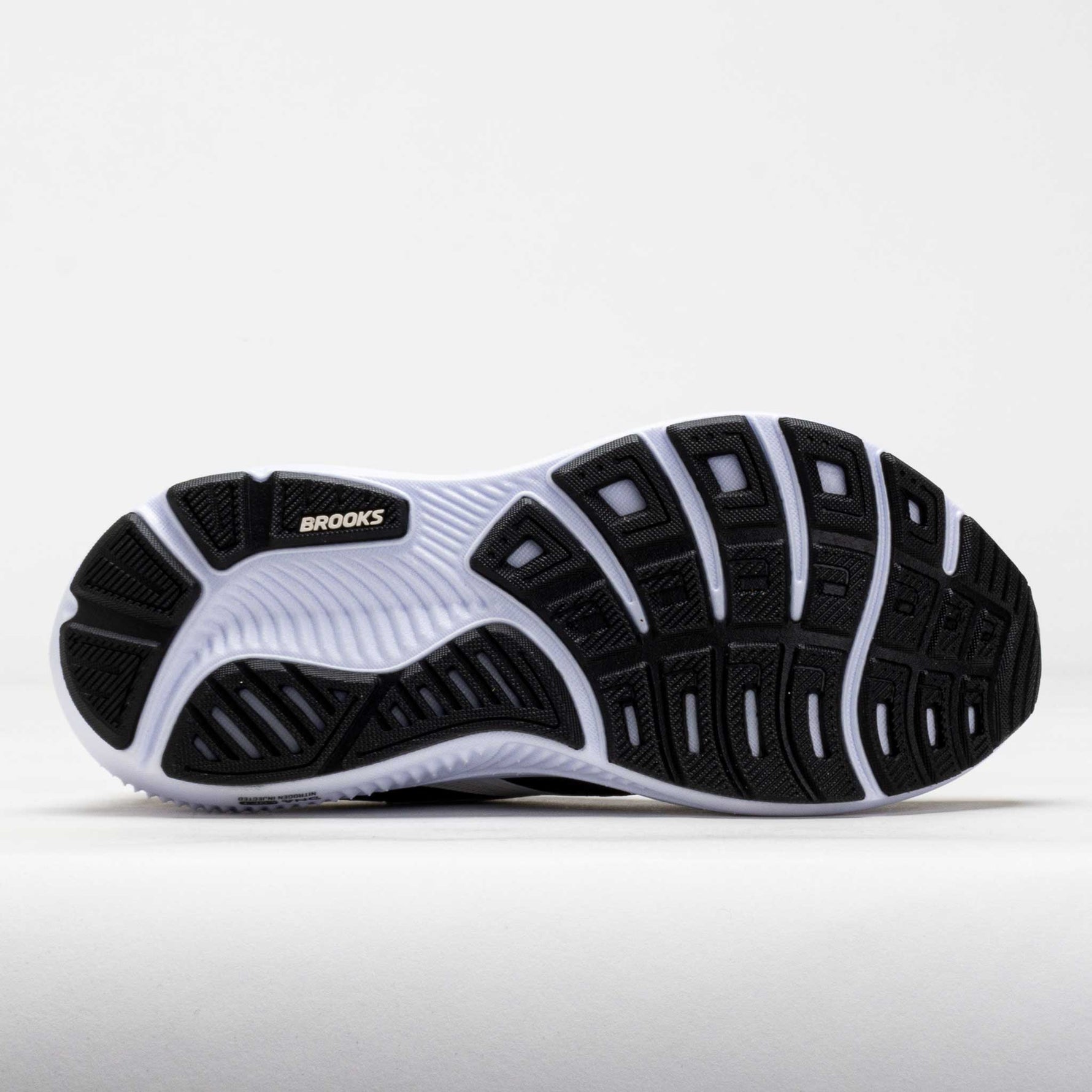 Brooks Ghost 18 running shoes in black and grey with white sole on clean background