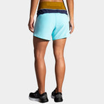 Brooks Chaser 5 inch women's running shorts in light blue colorblock design, back view