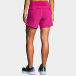 Brooks Chaser 5 inch women's running shorts in bright magenta pink, back view