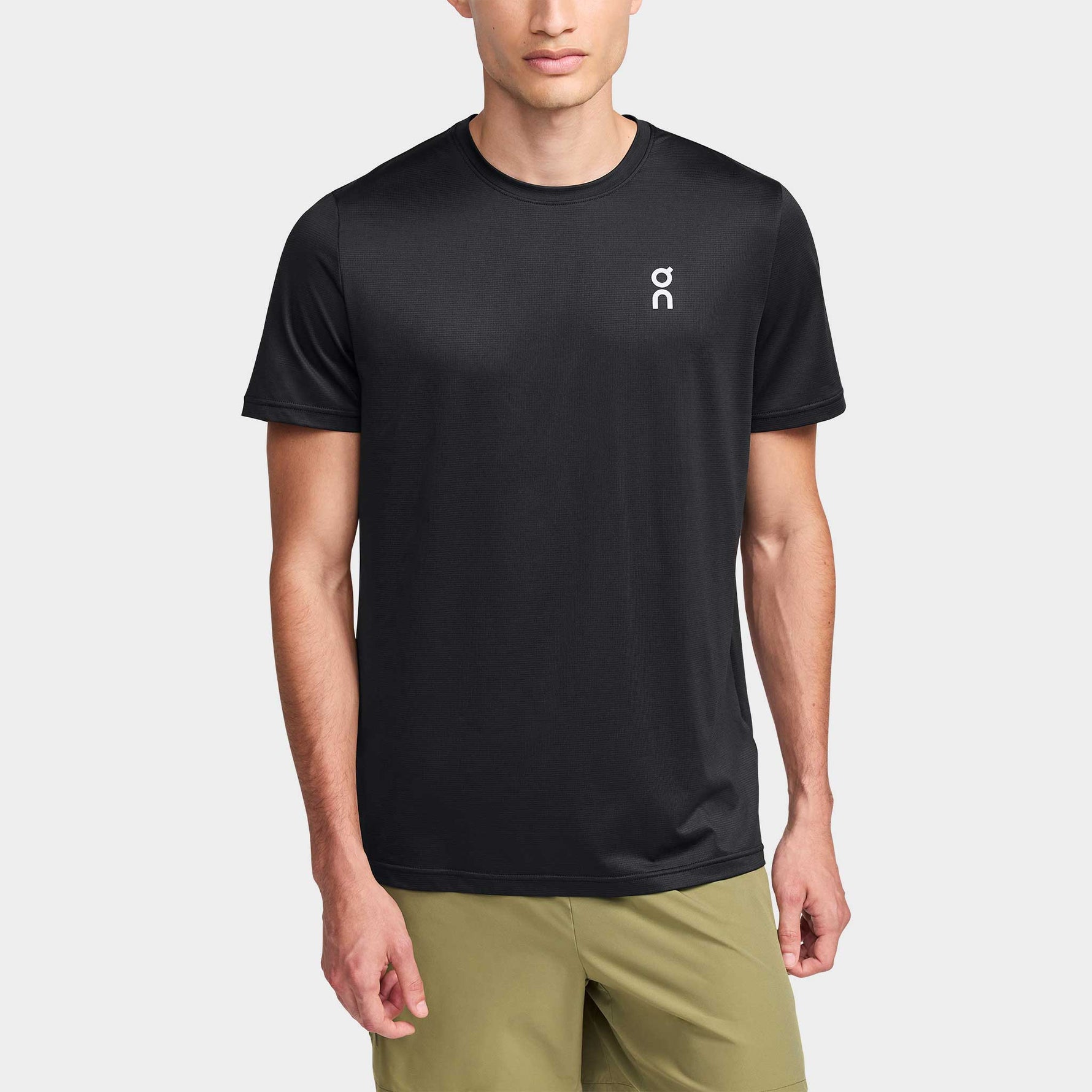 Man wearing black On Core-T performance t-shirt with small white logo