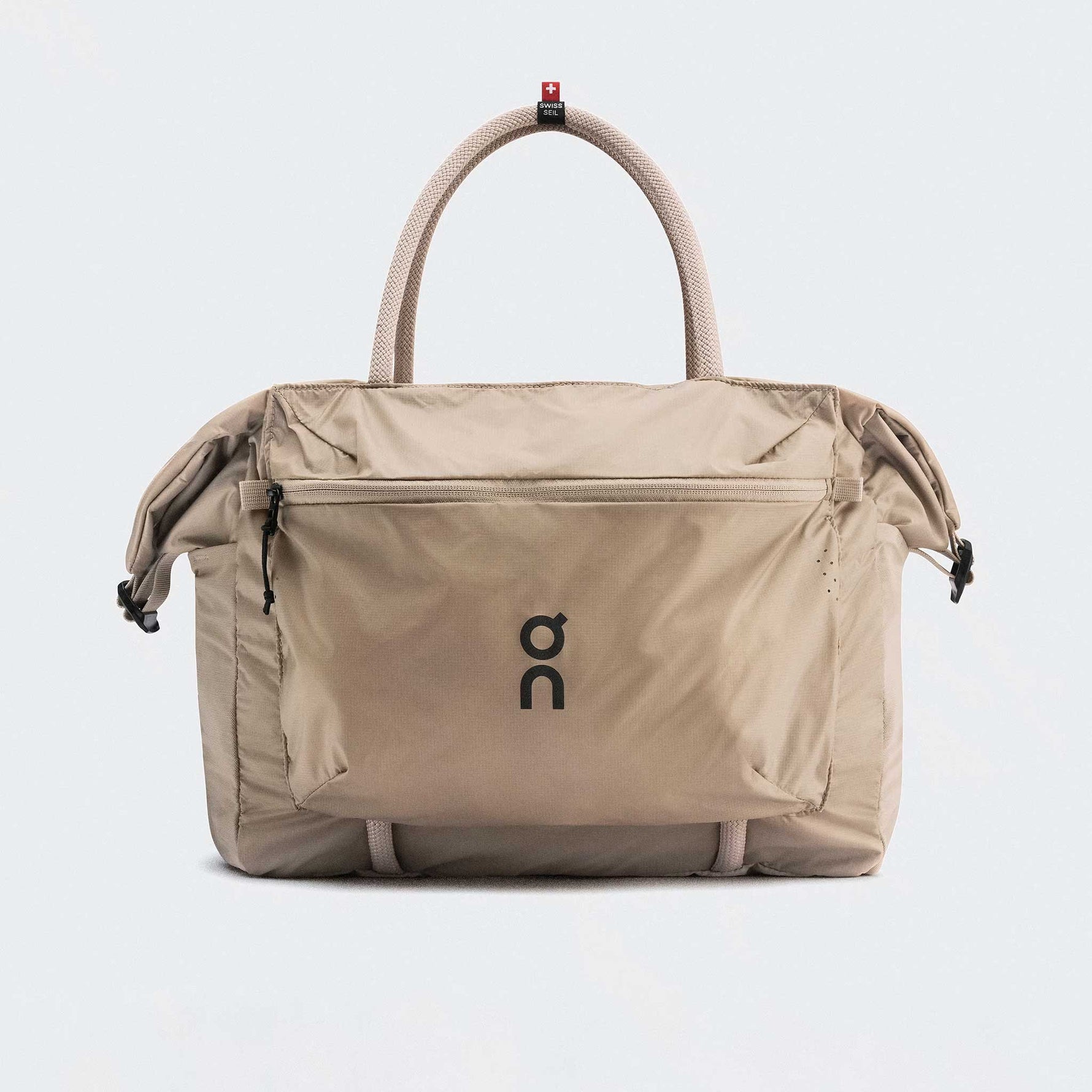 On Track Pack 35L Lite unisex backpack in sand beige color with Swiss flag tag