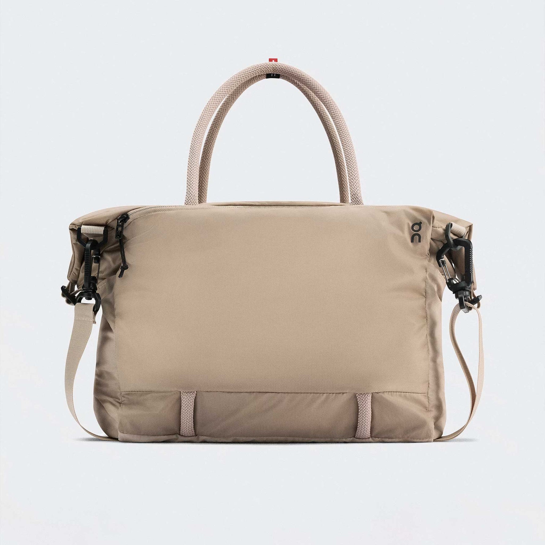 On Track Pack 35L Lite unisex bag in sand color with handles and straps