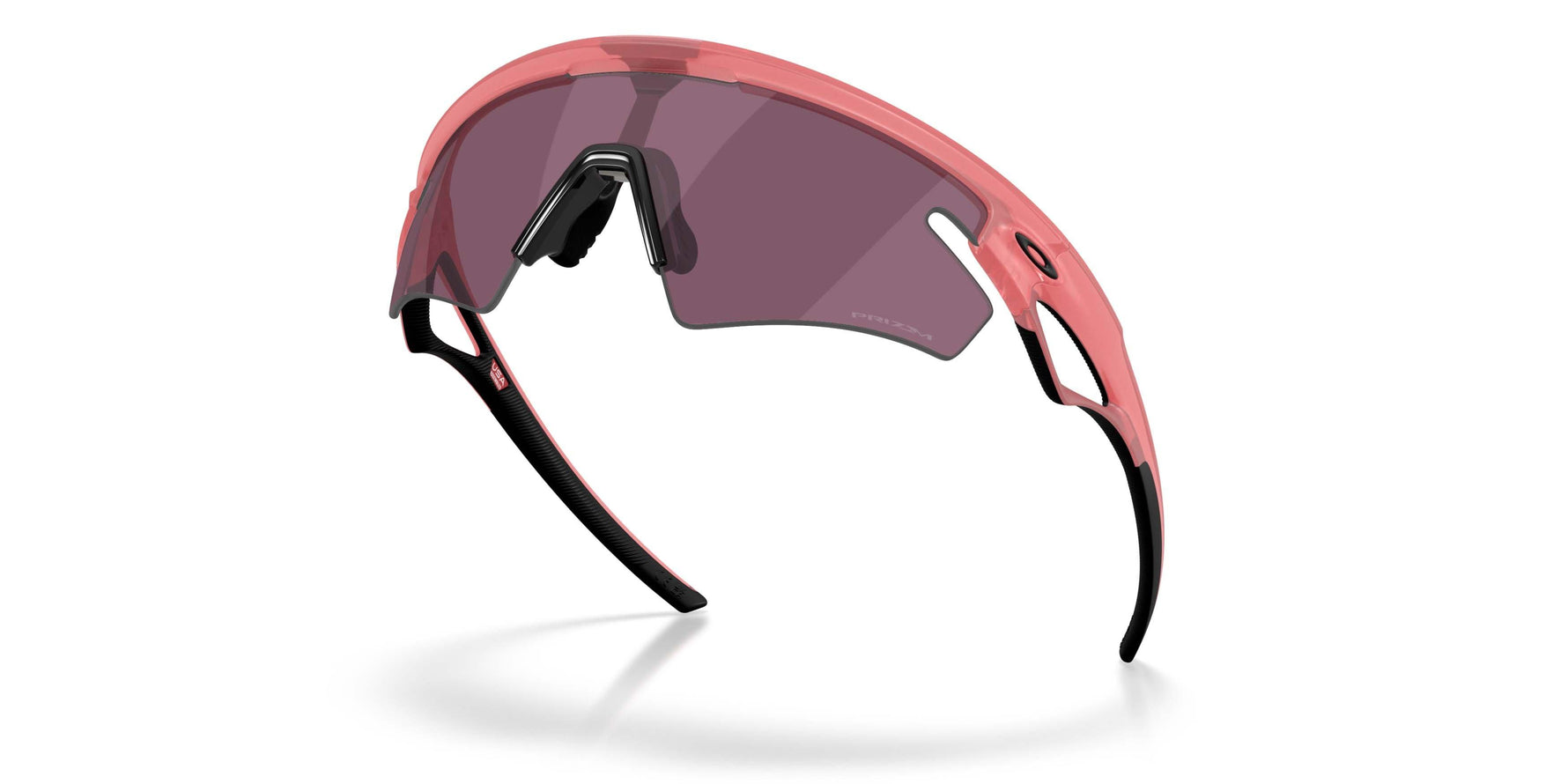 Oakley Sphaera sunglasses with coral pink frame and dark purple lenses