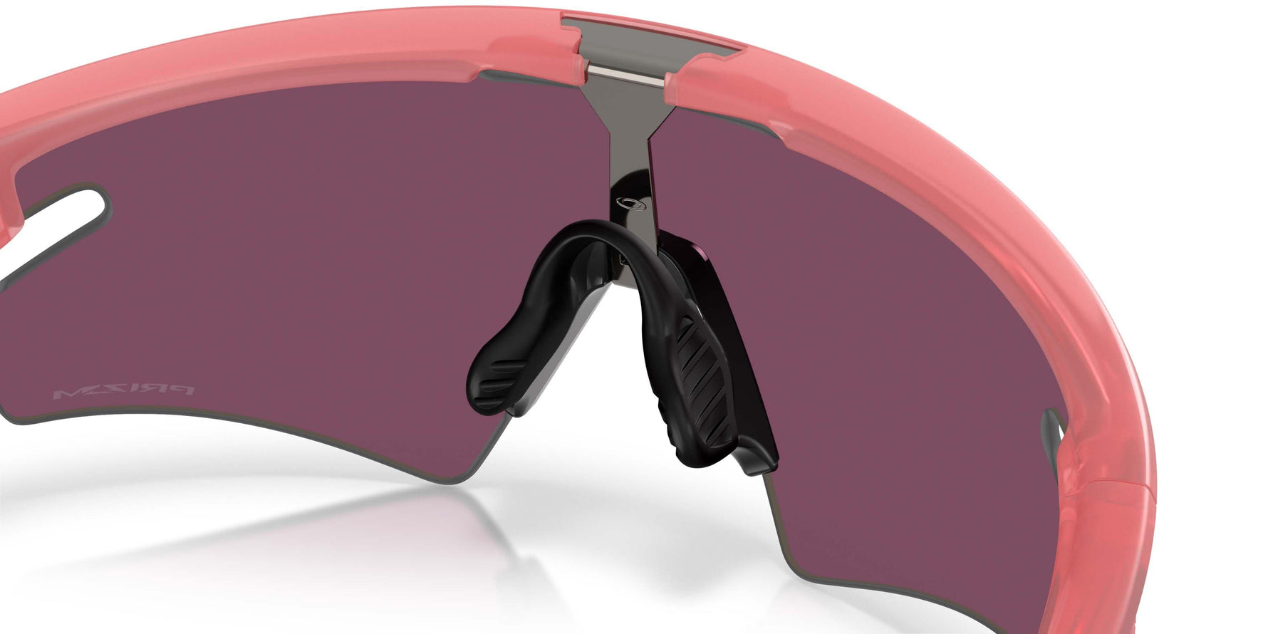 Oakley Sphaera sunglasses with coral pink frame and dark purple lenses on white background