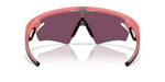 Oakley Sphaera sport sunglasses with pink frame and dark purple lenses on white background