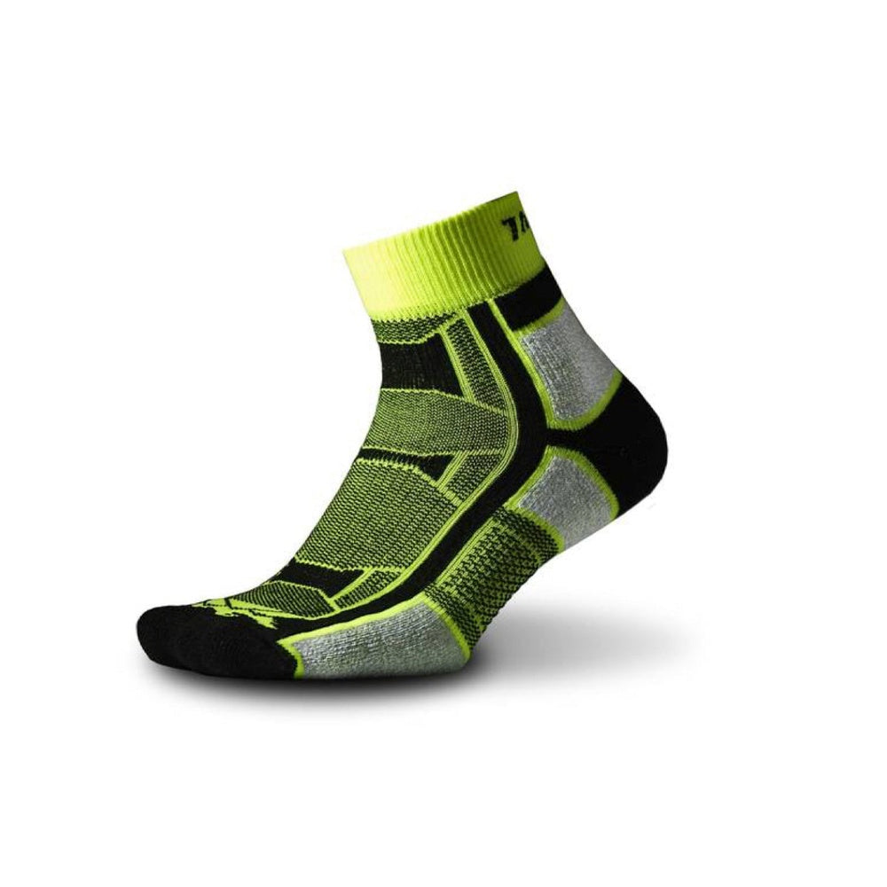 Thorlos athletic quarter sock in bright yellow-green with black heel and toe
