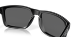 Close-up detail of Oakley Holbrook matte black frame bridge and Prizm Black lenses