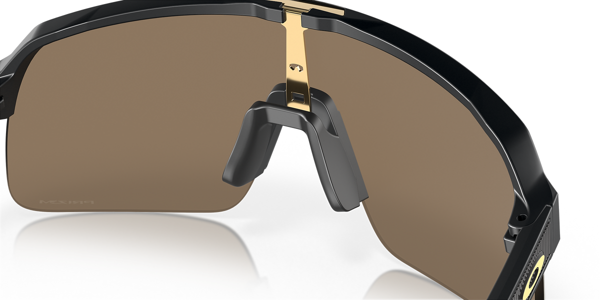 Close-up interior view of Oakley Sutro Lite showing gold nose bridge and nose pad detail
