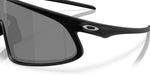 Close-up of black Oakley sunglasses with dark gray lenses and Oakley logo
