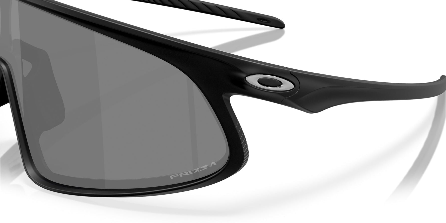 Close-up of black Oakley sunglasses with dark gray lenses and Oakley logo