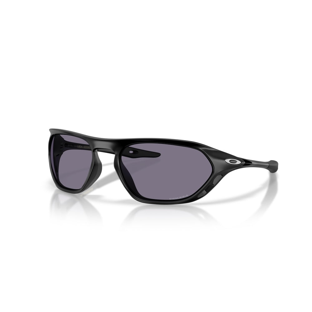 Oakley Cage Jacket sunglasses with matte black frame and Prizm grey lenses, three-quarter view