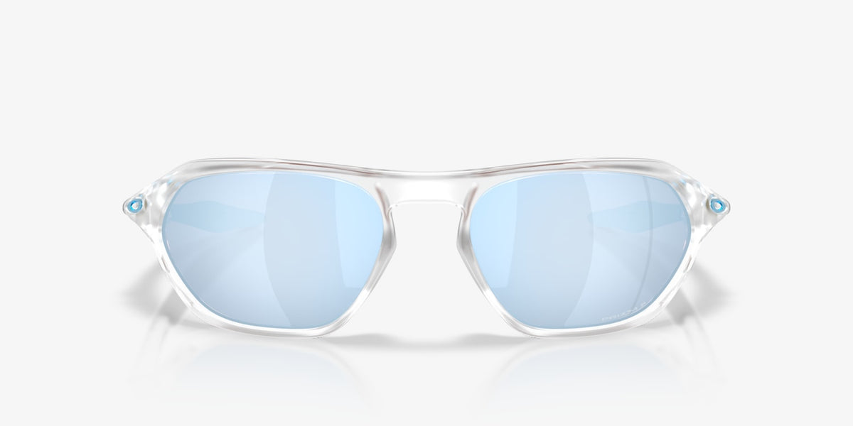 Oakley Cage Jacket sunglasses with clear frame and blue Prizm Deep Water lenses, front view