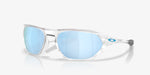 Oakley Cage Jacket sunglasses with clear frame and blue lenses, side angle view