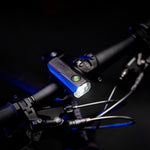 Lezyne KTV Drive Pro bicycle light mounted on bike handlebars with blue accent