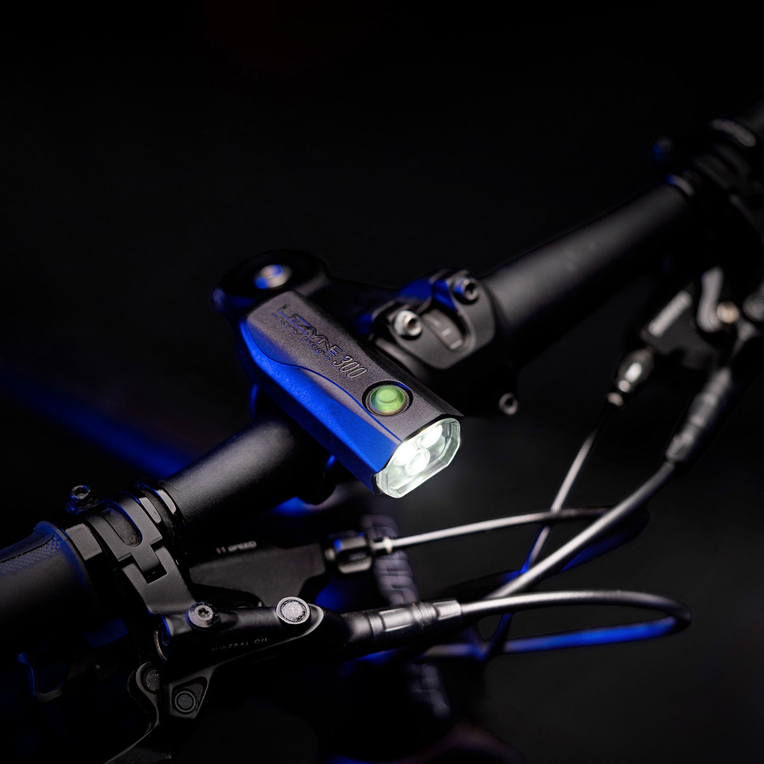 Lezyne KTV Drive Pro bicycle light mounted on bike handlebars with blue accent