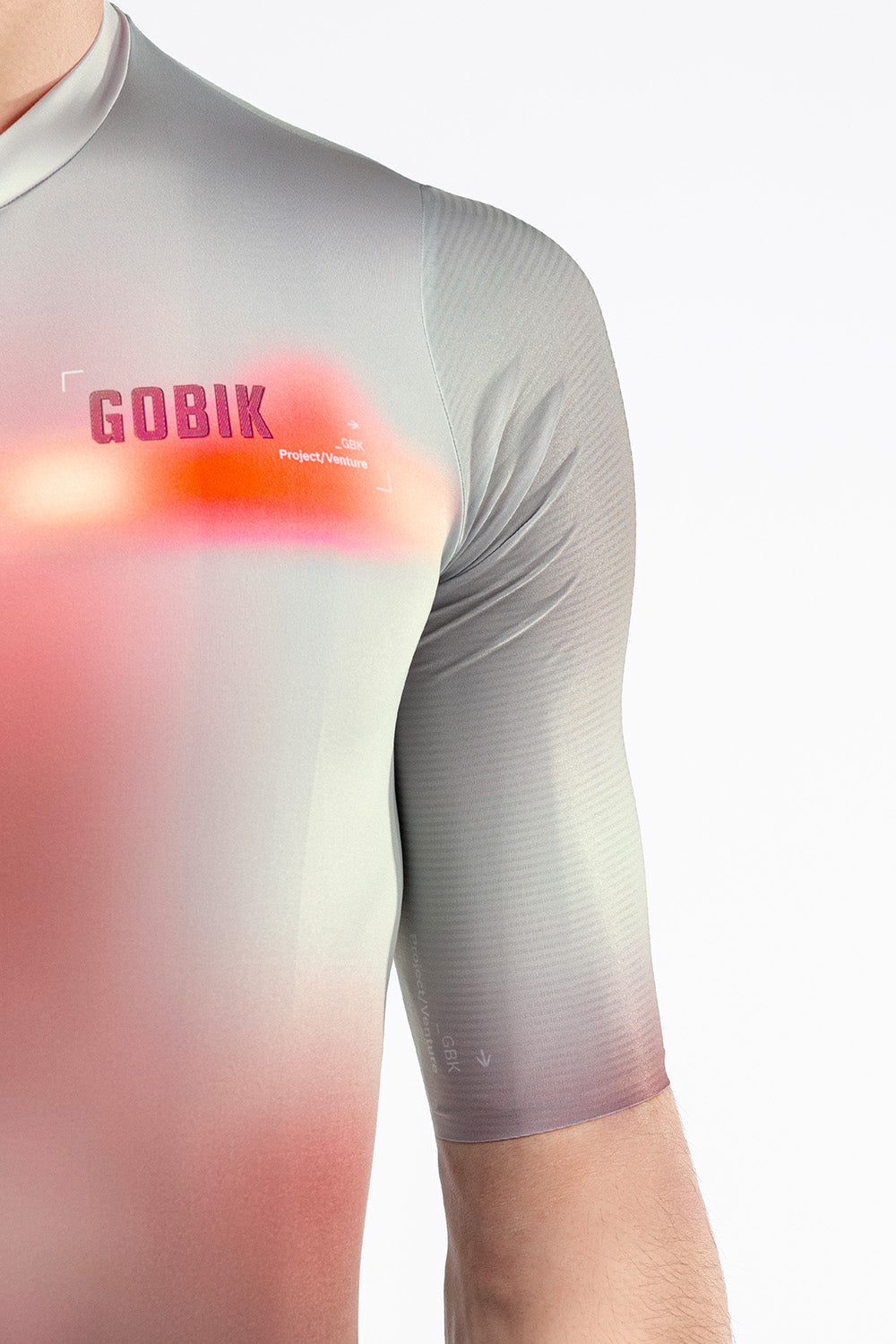 Close-up shoulder and chest detail of Gobik Attitude 2.0 jersey in Flank showing coral heat-map graphic