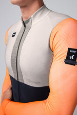Gobik Hyder Blend long sleeve cycling jersey in orange and gray colorblock design