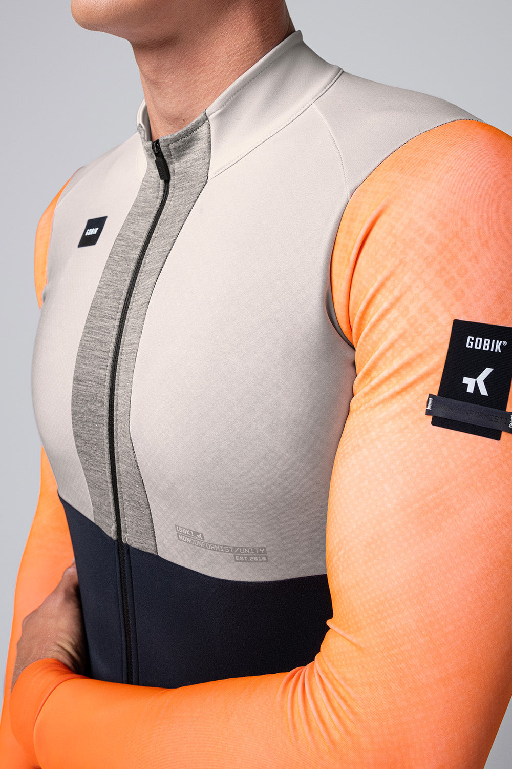 Gobik Hyder Blend long sleeve cycling jersey in orange and gray colorblock design