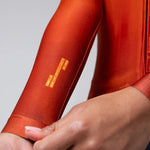 Gobik CX Pro 3.0 Long Sleeve Jersey in burnt orange showing torso and arm detail