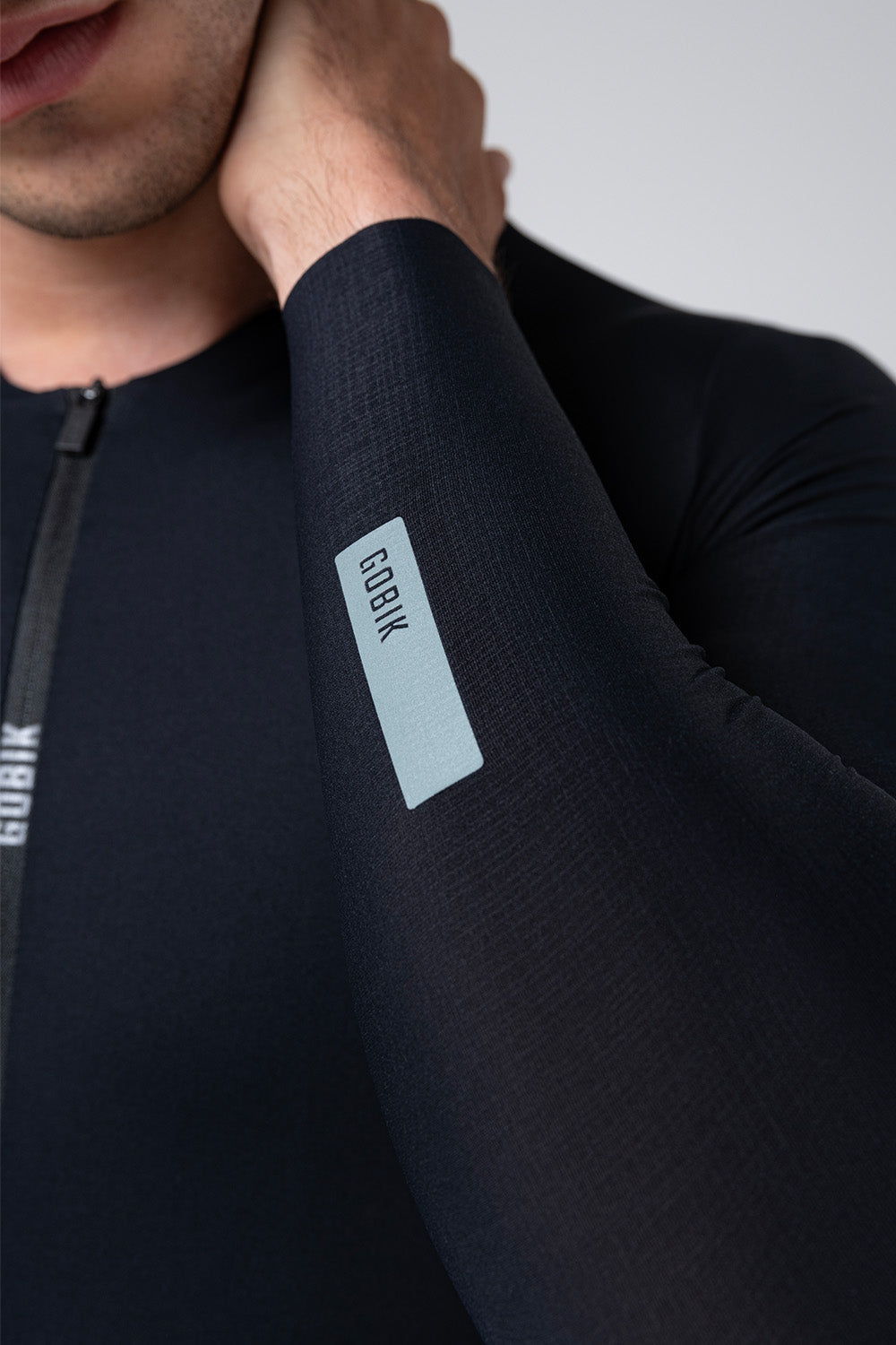 Black Gobik Avalon Ink long sleeve cycling jersey with reflective details on model