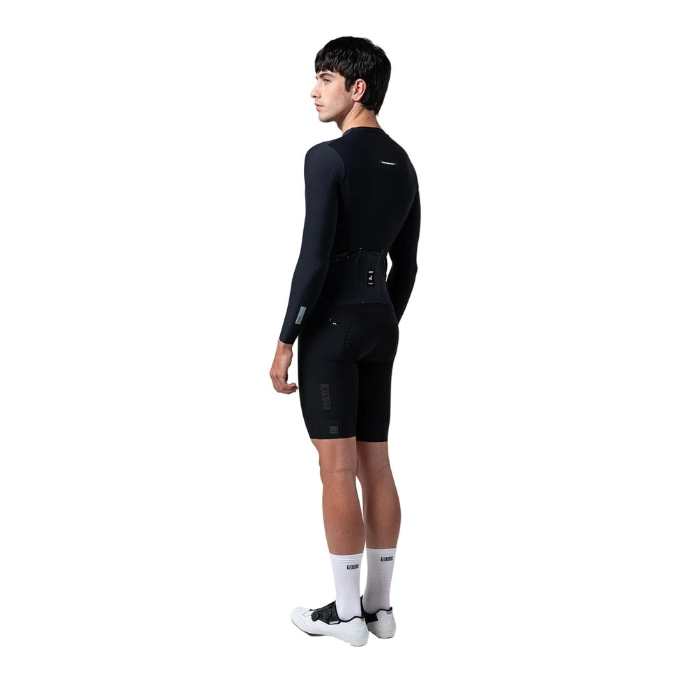 Man wearing black Gobik Avalon long sleeve cycling jersey with matching shorts
