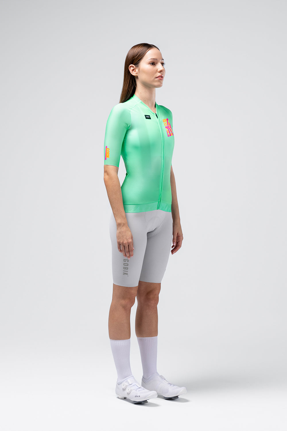 Female cyclist wearing Gobik CX Pro 4.0 mint green jersey with grey bib shorts