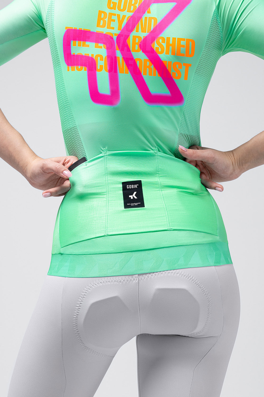 Gobik CX Pro 4.0 cycling jersey in Blast colorway shown from back on female model