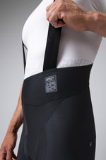 Gobik Absolute 7.0 black cycling bib shorts with shoulder straps on model