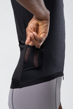 Close-up detail of Gobik Vector 2.0 Men's vest in Crow showing mesh side panel and pocket
