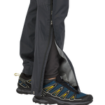 Black Patagonia Torrentshell 3L pants with side zip vents and trail running shoes