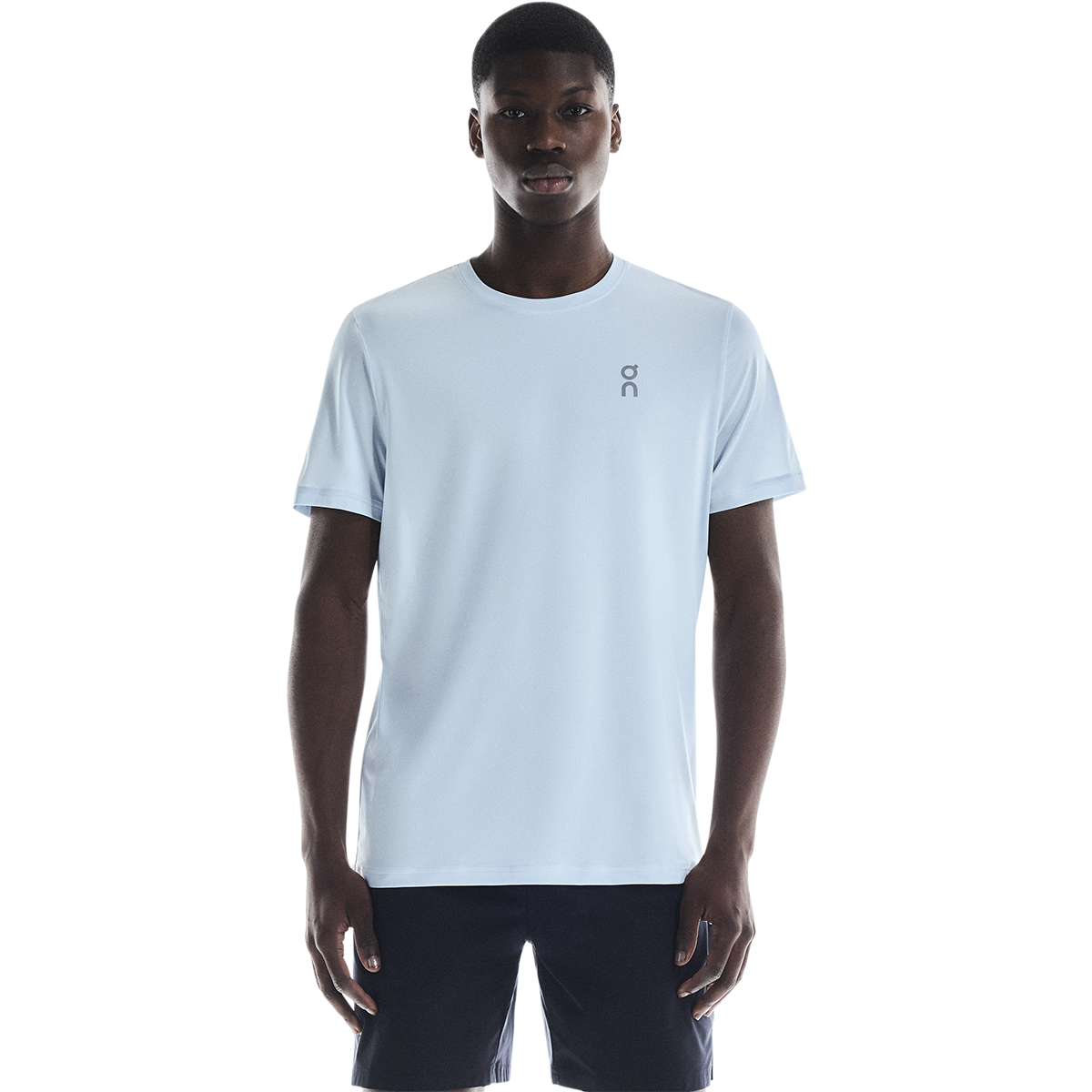 Man wearing light blue On Core-T shirt with small logo on chest