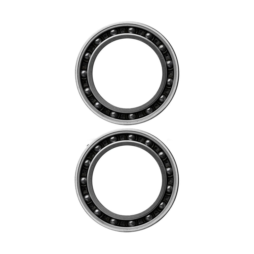 Two CeramicSpeed BB86 Campy UT ceramic ball bearings with black inner rings and silver outer rings